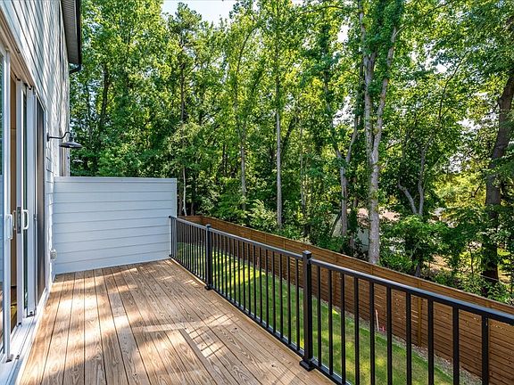 Private second floor balcony with wooded view