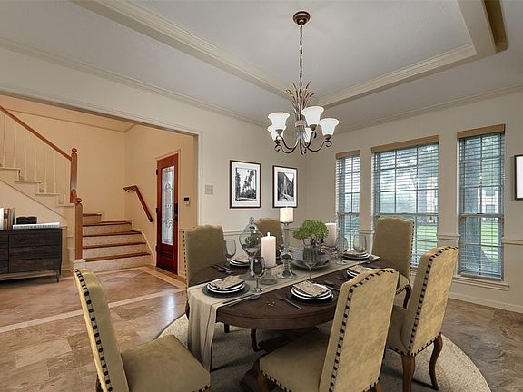 Virtually staged dining room and entry