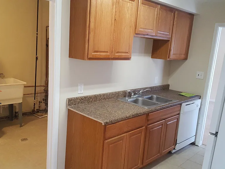Laundry room ad Kitchen with tiles all across