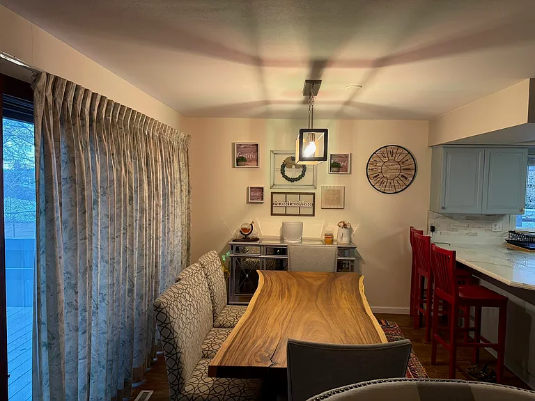 Dining room with sliding door access to the private side patio.