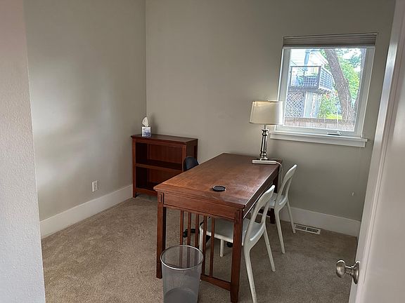 Downstairs bedroom set up as an office.