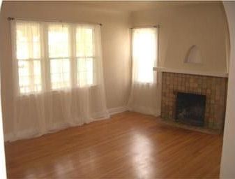 Gleaming Hardwood Floors & Fireplace