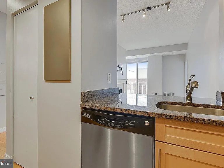 View to living area from kitchen with pantry