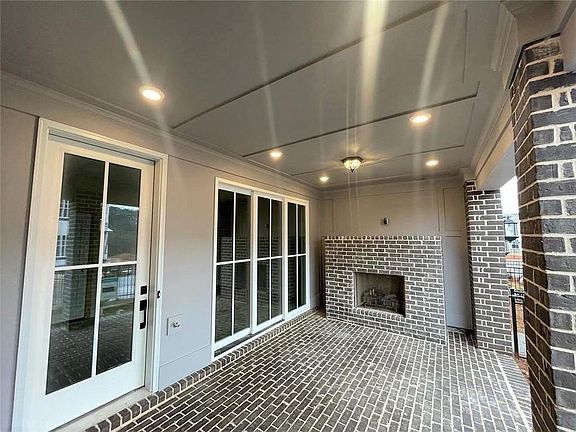 Front entrance and upgraded SLIDER here onto patio. It is easy to picture lots of time spent here