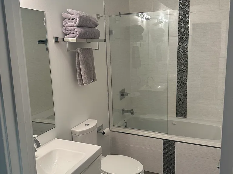Full bathroom with massage tub with ensuite and separate entrances