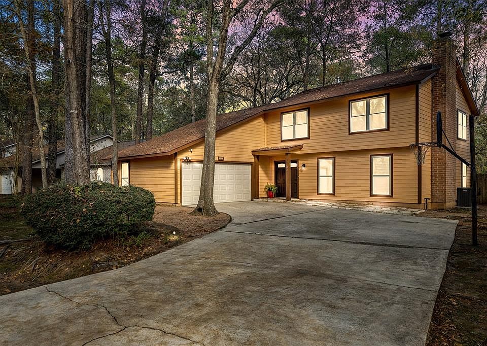 Beautiful well maintained 2-story home in wooded corner lot.