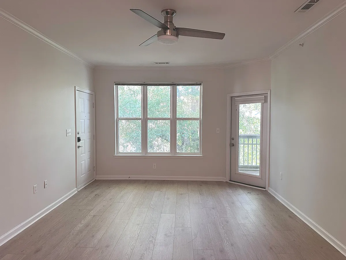 Living Room with brand-new flooring - 600 Bucksley Ln #303