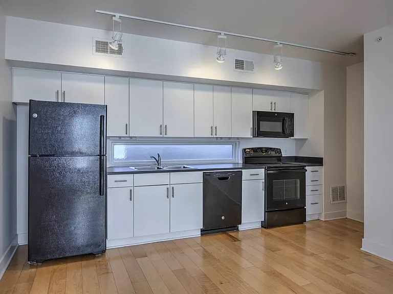 Black appliances in a kitchen at The Sawyer.