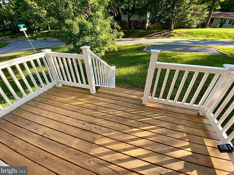 Front deck and entrance with spacious 2 car off street parking pad.