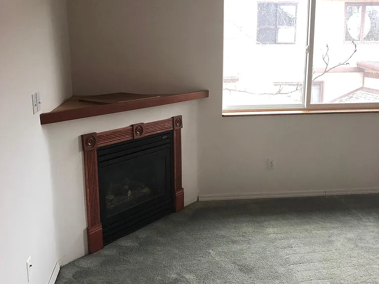 Gas fireplace and custom wood surrounds.