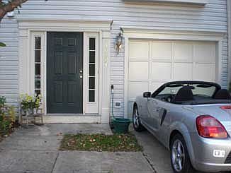 Close up of car and front of home.
