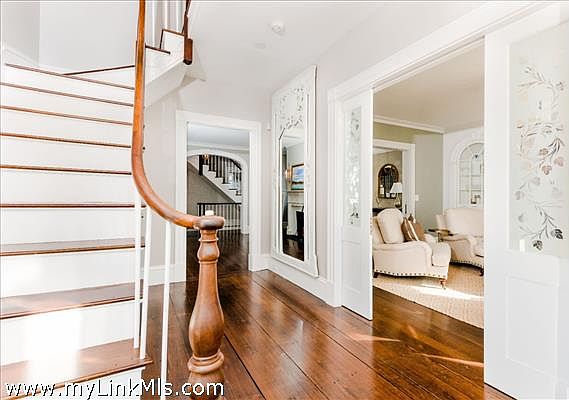 Elegant foyer and restored original stairway