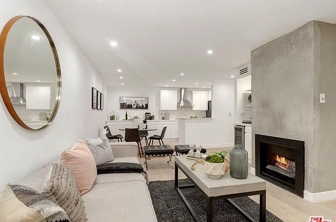 Living room and semi open kitchen. Upgraded furniture in photo 2