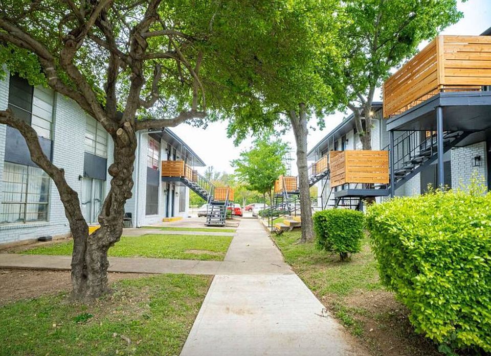 Tree-lined walkways in a peaceful Dallas apartment community