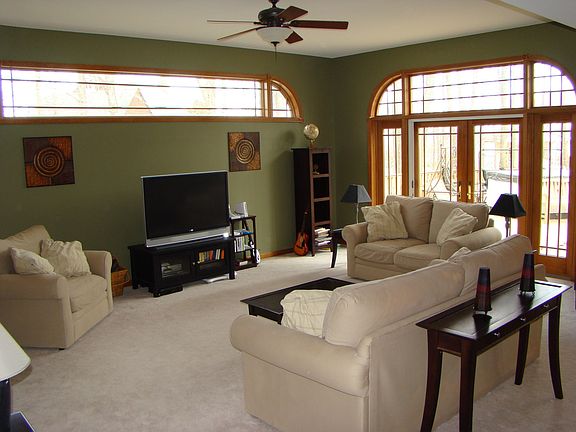 family room with transome window and french doors to deck