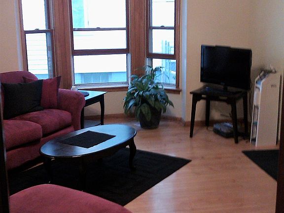Large Living Room with Plenty of Natural light & easy to clean Hardwood floors