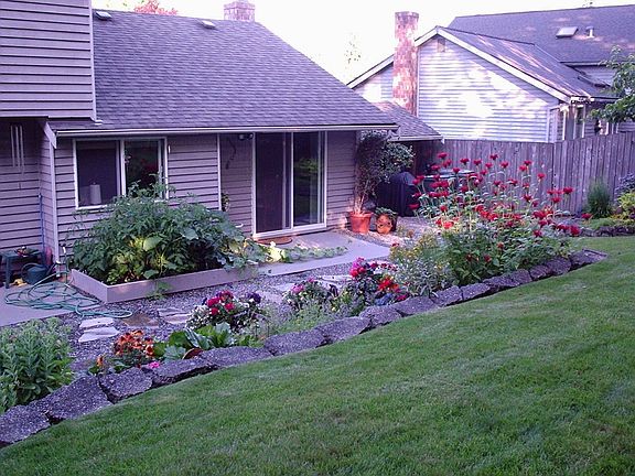 back yard with new raised bed garden