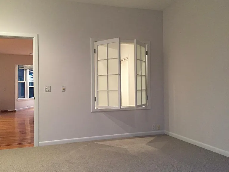 View of the master bedroom into the bathroom. The windows are translucent and allows for natural light in the bathroom and watching TV while soaking in the tub.