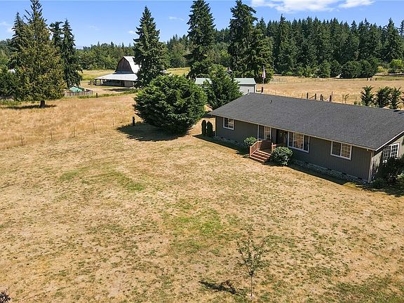 Well kept 2350 sq ft rambler on 5 usable acres.