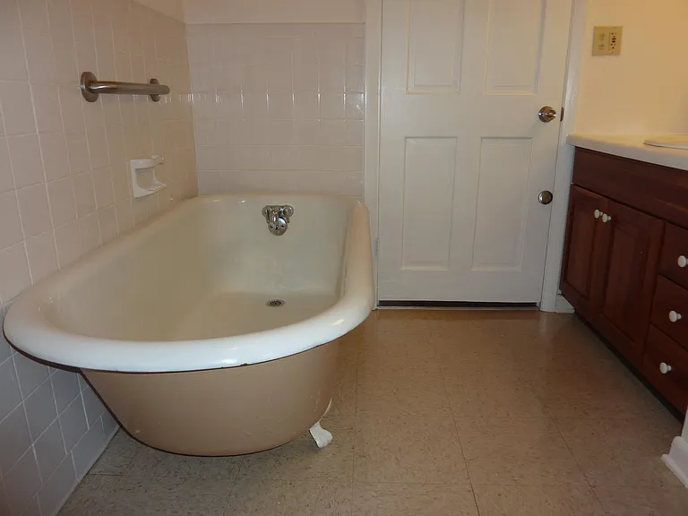 Clawfoot tub original to building.