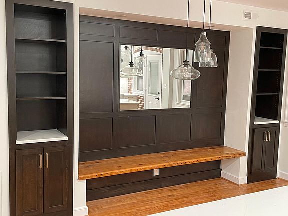 Dining room, with built-in bench, and cabinet system.