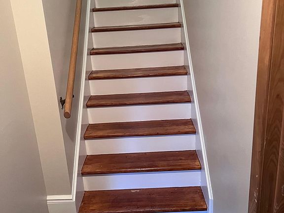 Indoor steps connected to the parking garage that leads to unit 2.