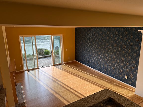 Mirrored wall behind wallpaper if you wish to double the space.