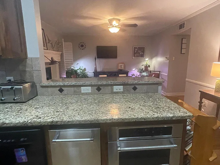 Kitchen Aid Red Dot Appliances Microwave and Trash Compactor shown here.
