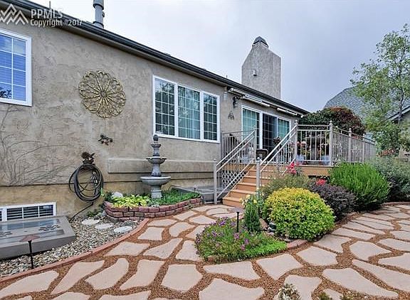 the rear composite deck and flower garden.