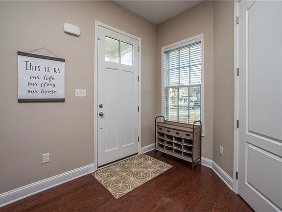 The entry opens into the home's great room.  Just inside the door is a guest coat closet.