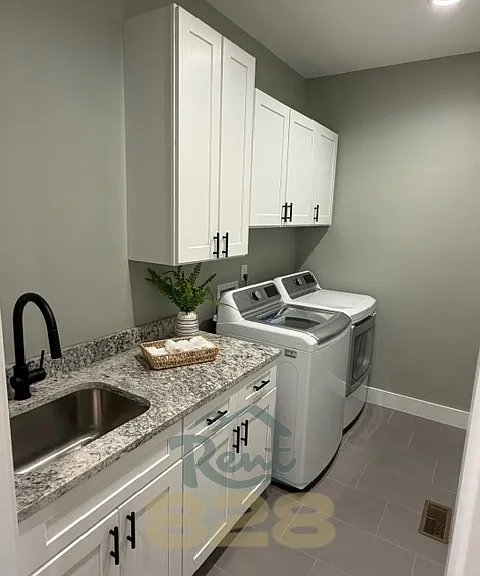 laundry room with washer & dryer provided