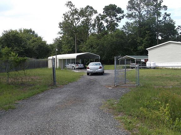 Driveway and double gates from road
