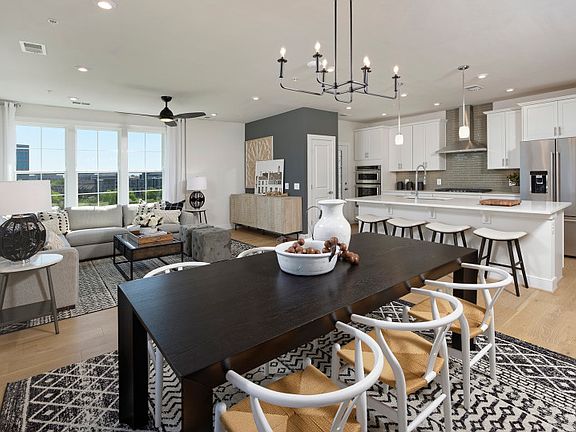 Model Representation - Dining Room Flows into the Kitchen and Gathering Room in the Declan Condo.
