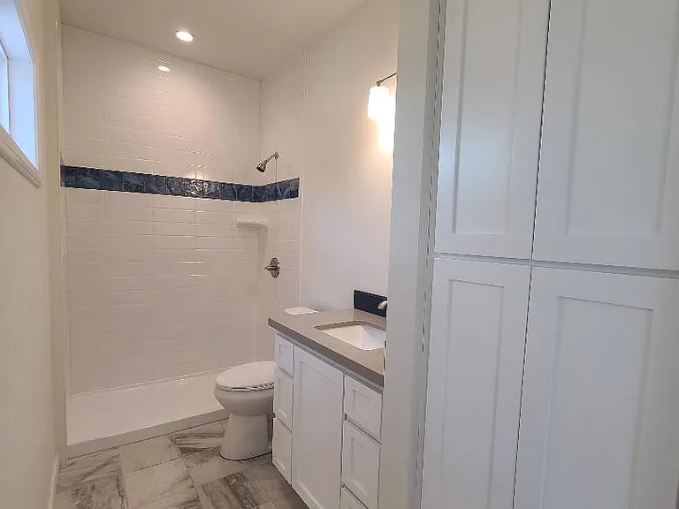Bathroom 1 - Shower doors being installed