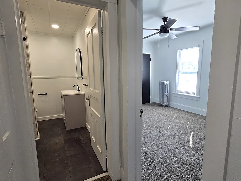 2nd Floor hall looking into Bathroom and Bedroom 1