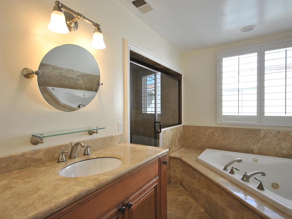 Remodeled hall bath with separate shower and tub