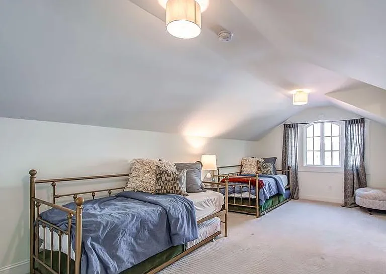 Upstairs bedroom- back section with day beds