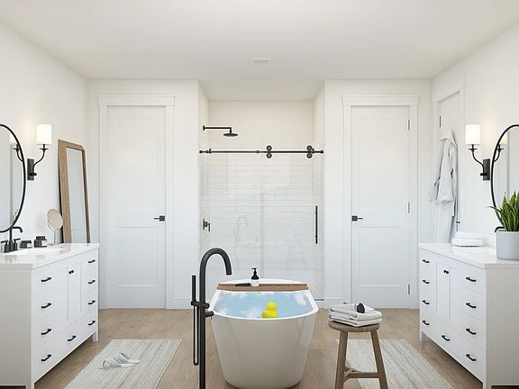 Primary bath with dual freestanding vanities
