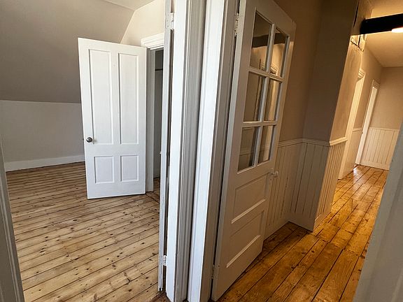 1st bedroom door on the left and other hallway leading to other rooms and kitchen on the right