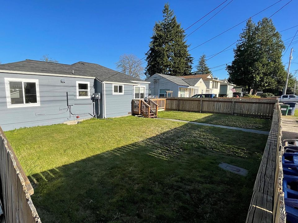 Fenced in yard with front porch.