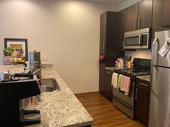 A shot of the kitchen space. Note the countertops and amble cabinets for storage.