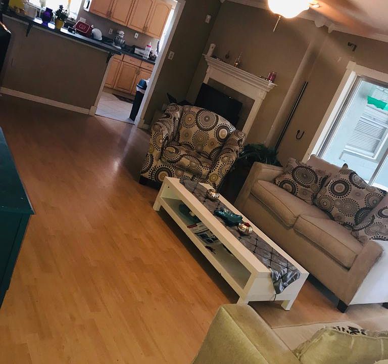 Rear living room with sliding door To patio and pool and breakfast bar