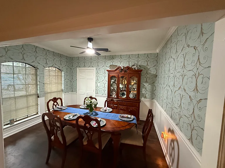One of two dining areas with furniture to show scale.