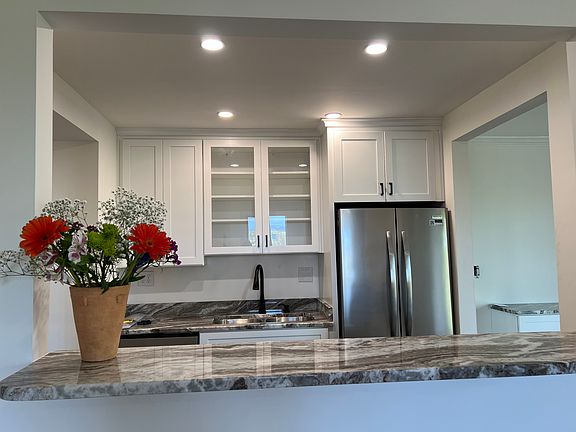 brand new kitchen, with bar sitting area