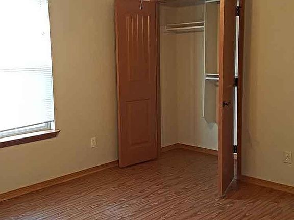 Bedroom 1 with large closet and ceiling fan