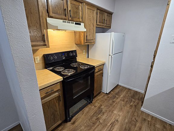 Electric 4 burner stove/Oven. Fridge provided.
