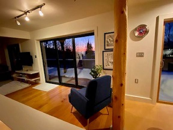 space between living room and dining room leading to back porch