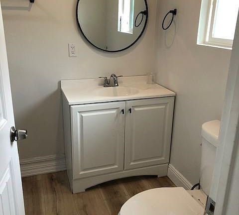 Restroom has a stand up shower no bathtub