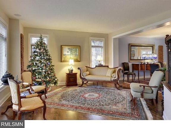 Living room has hardwood floors. Floors have recently been stripped, sanded and restained to a beautiful dark color.