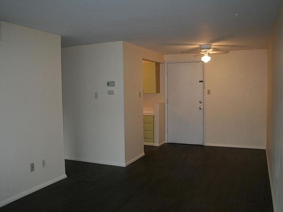living and dining room with ceiling fan and new vinyl plank